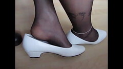 white patent leather pumps and black nylons, shoeplay and dangling by Isabelle-Sandrine Thumb