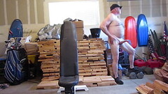 Naked and hard in the open garage. Thumb