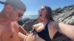 Hot brunette fucks a stranger on a public beach Thumb