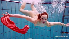 Adorable brunette teen swimming naked Thumb