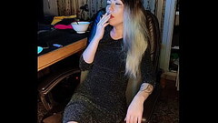 adult stepdaughter smokes a cigarette Thumb